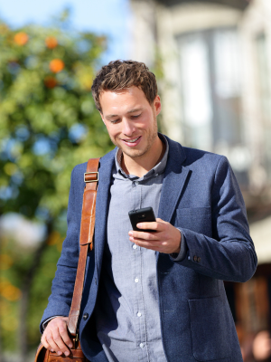 Image shows a person checking a phone, indicating detailed report sent after every service.
